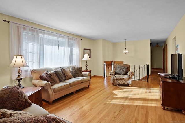 living room with light hardwood / wood-style flooring