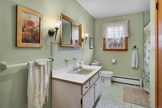 bathroom with toilet, tile patterned flooring, baseboard heating, vanity, and backsplash