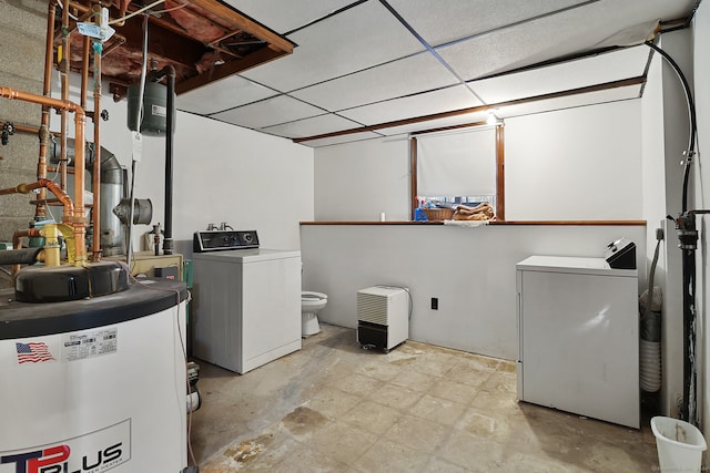 laundry area featuring water heater and separate washer and dryer