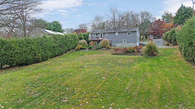 view of yard with a wooden deck