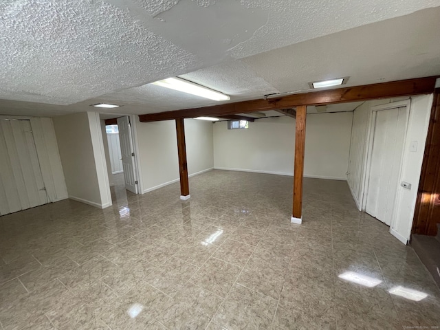 basement with a textured ceiling