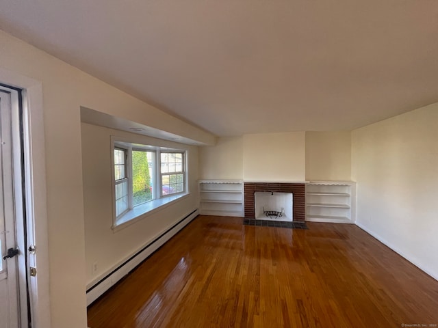 unfurnished living room with a fireplace, wood-type flooring, and a baseboard heating unit