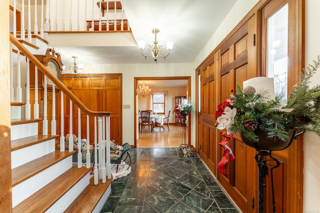 entrance foyer with a chandelier