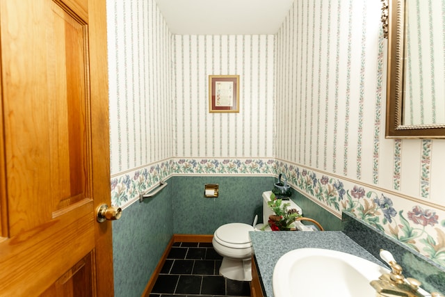 bathroom featuring tile patterned flooring, vanity, and toilet