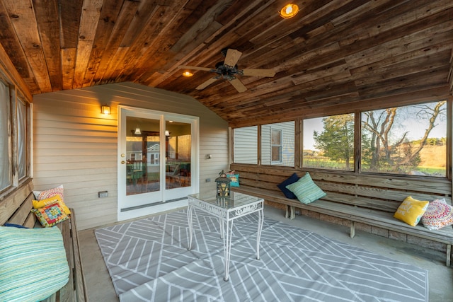 sunroom / solarium featuring wooden ceiling, ceiling fan, and lofted ceiling