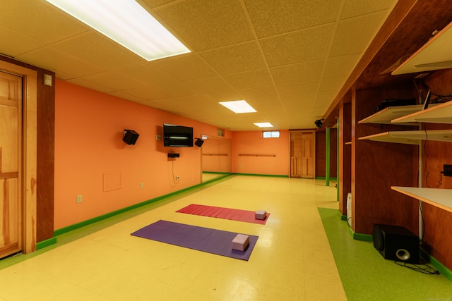 exercise area featuring a paneled ceiling