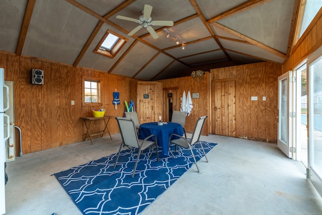 sunroom / solarium with vaulted ceiling with skylight and ceiling fan