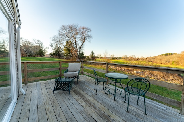 wooden terrace with a yard