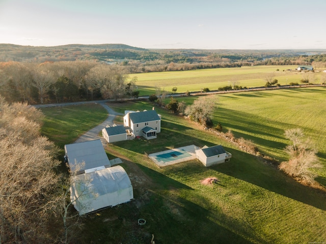 birds eye view of property with a rural view