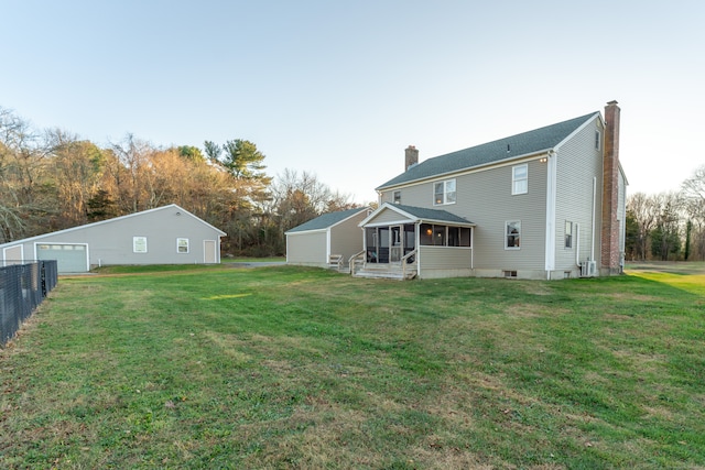 back of house featuring a yard, central air condition unit, and a sunroom