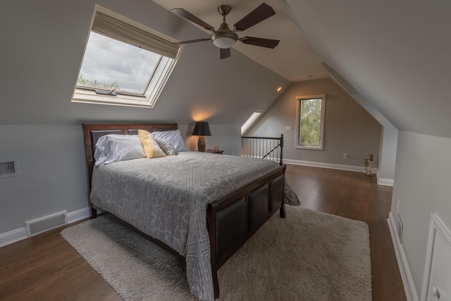 bedroom featuring baseboards, visible vents, dark wood-style floors, and lofted ceiling