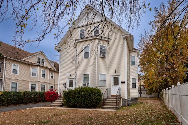 rear view of property featuring cooling unit