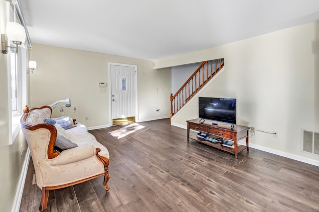 living room featuring dark hardwood / wood-style floors