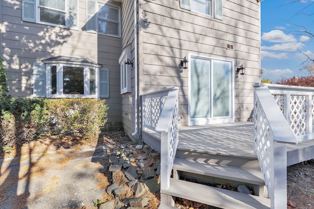 property entrance featuring a wooden deck