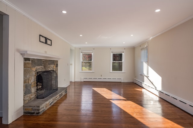 unfurnished living room featuring dark hardwood / wood-style flooring, a fireplace, a baseboard radiator, and crown molding