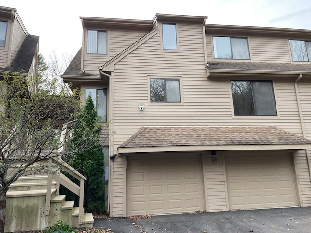 view of side of property featuring a garage