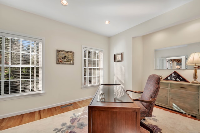 office area with light hardwood / wood-style flooring