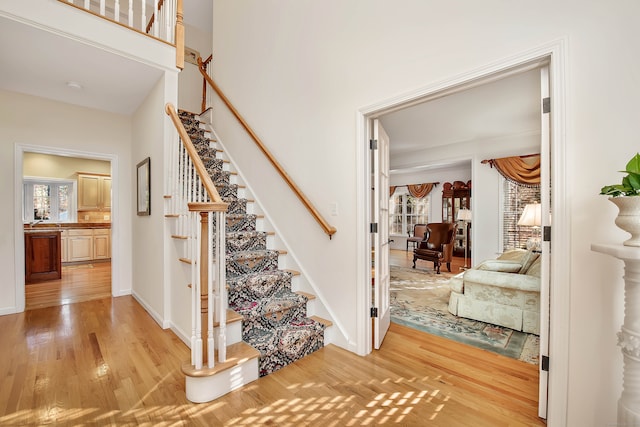 stairs with wood-type flooring