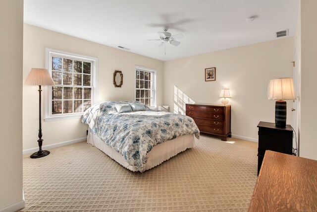 bedroom with ceiling fan and carpet floors