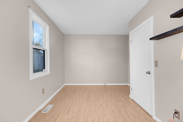 spare room with light hardwood / wood-style floors