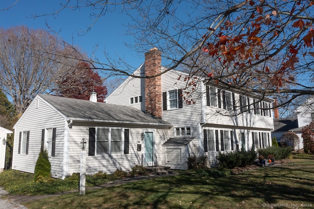 view of home's exterior with a yard