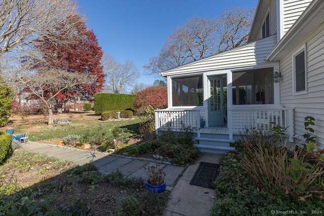 view of yard with a sunroom