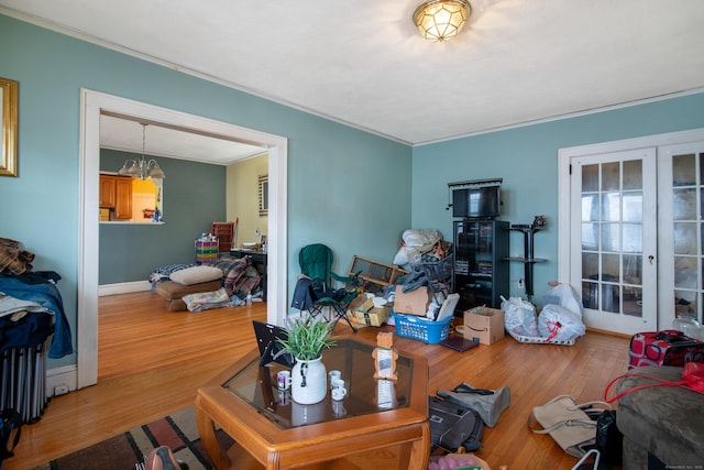 233 Pearl St, Middletown, CT 06457 - living room with ornamental molding, french doors, wood finished floors, and baseboards