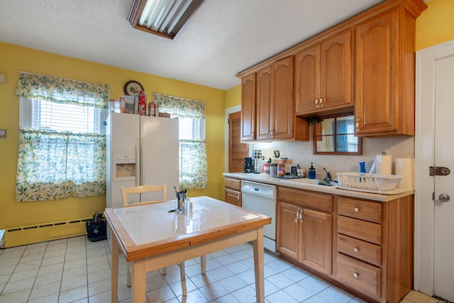 233 Pearl St, Middletown, CT 06457 - kitchen with white appliances, tile counters, baseboard heating, a textured ceiling, and a sink