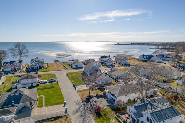 bird's eye view featuring a water view and a residential view