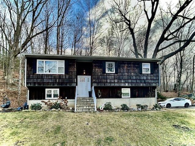 bi-level home with a front yard