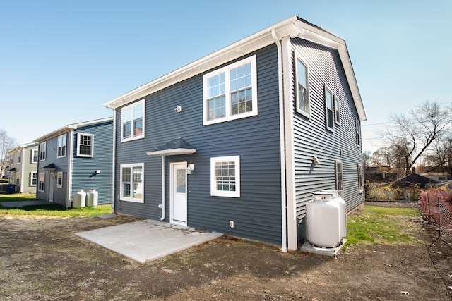 back of property with a patio area