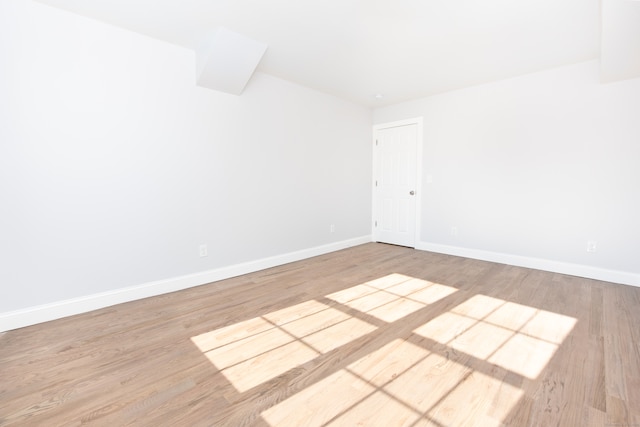 spare room featuring light wood-type flooring