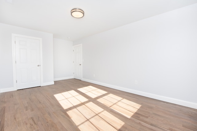 unfurnished room featuring hardwood / wood-style floors