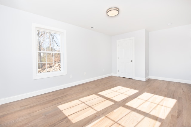 unfurnished room featuring light hardwood / wood-style floors