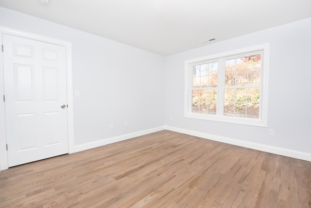 unfurnished room featuring light wood-type flooring