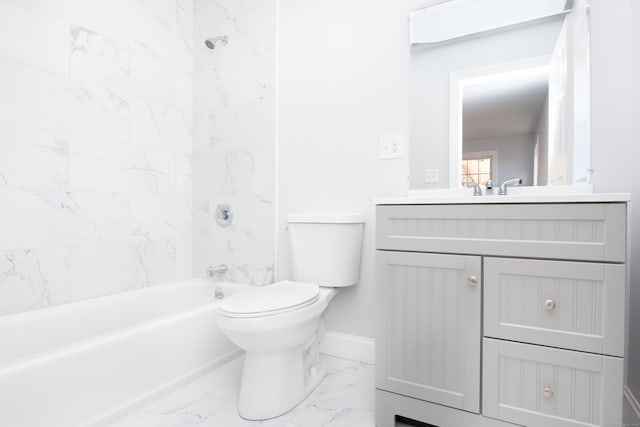 full bathroom with vanity, toilet, and tiled shower / bath