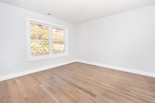 unfurnished room with light hardwood / wood-style flooring