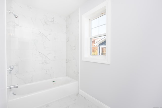 bathroom with tiled shower / bath combo