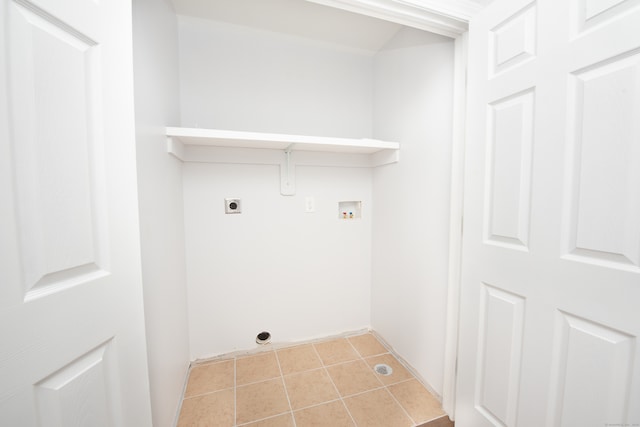 laundry room with hookup for a washing machine, light tile patterned floors, and hookup for an electric dryer