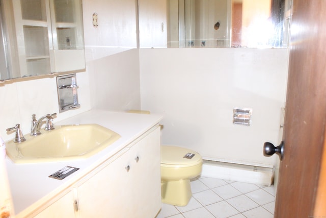 bathroom featuring toilet, vanity, and tile patterned floors