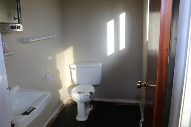 bathroom with toilet and sink