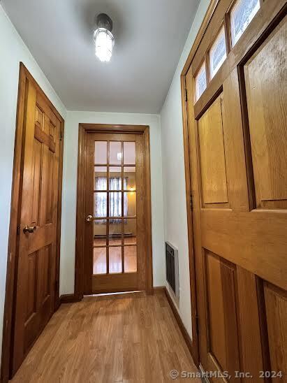 entryway with light hardwood / wood-style flooring