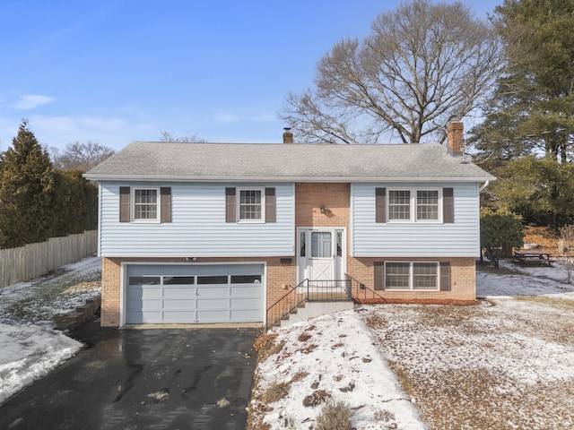 bi-level home featuring a garage