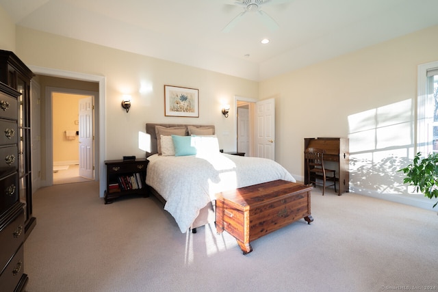 carpeted bedroom featuring ceiling fan and connected bathroom