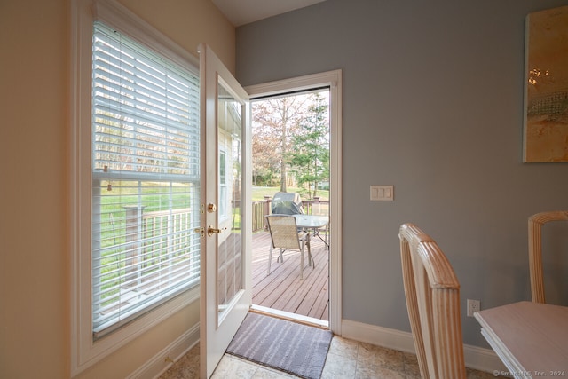 doorway to outside featuring light tile patterned floors