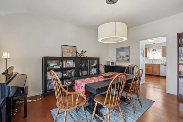 dining area with sink and dark hardwood / wood-style floors