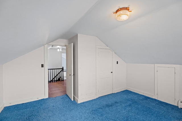 bonus room featuring carpet floors, a baseboard radiator, and vaulted ceiling