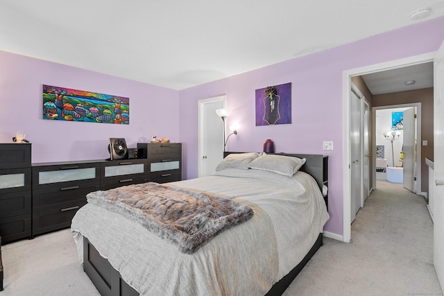 bedroom with light colored carpet