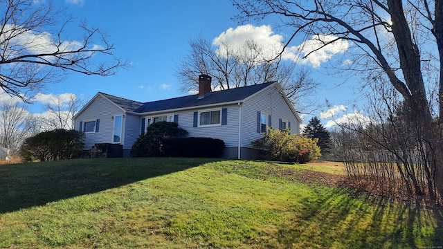 view of home's exterior with a lawn