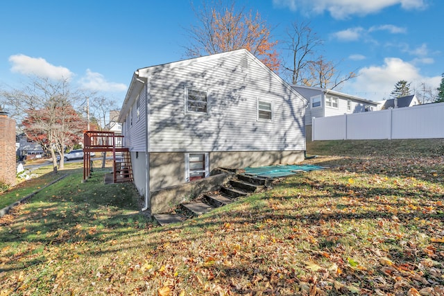 view of property exterior with a lawn